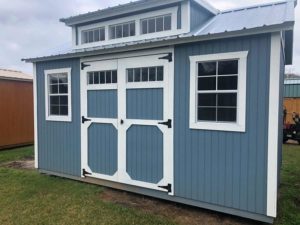 Portable dormer shed, blue, with barn door and windows